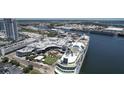 Panoramic aerial view of a cruise ship docked near a waterfront complex in a bustling city at 612 Arbor Lake Ln, Tampa, FL 33602