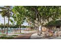 Picturesque outdoor dining area with cafe tables and beautiful landscaping at 805 S Gulfview Blvd # 701B, Clearwater, FL 33767