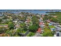 Aerial view of the neighborhood, showcasing lush greenery and easy access to bay at 11764 Pinedale Ave, Seminole, FL 33772