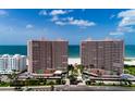 Condo complex with lush landscaping, tennis courts, ocean views, and beach access at 1310 Gulf Blvd # 6C, Clearwater Beach, FL 33767