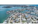 Stunning aerial view of waterfront homes with boat docks on a scenic canal, perfect for boating enthusiasts at 13124 4Th E St, Madeira Beach, FL 33708