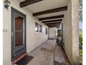 Inviting front porch features tiled entryway and decorative beams above at 1701 Pinehurst Rd # 9G, Dunedin, FL 34698