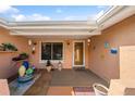 Inviting front porch with charming decor, plants, and a welcoming entrance at 1707 Hibiscus S Cir, Oldsmar, FL 34677