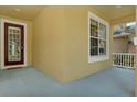 Inviting front porch featuring a blue floor, windows, and a front door at 20106 Bending Creek Pl, Tampa, FL 33647