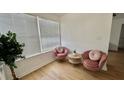 Cozy living room features comfortable seating, a modern table, and natural light from a large window at 2219 Thrace St, Tampa, FL 33605