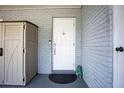 Charming front entrance boasts a stylish white door and a modern brick facade at 2403 E Osborne Ave, Tampa, FL 33610