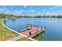 Waterfront property featuring a private boat dock and gorgeous bay views, ideal for boating and enjoying waterfront living at 4321 Sunrise S Dr, St Petersburg, FL 33705