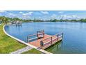Waterfront view featuring a private wooden dock with views of the bay and skyline at 4321 Sunrise S Dr, St Petersburg, FL 33705