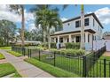 Stylish two-story home with a fenced yard and well-maintained lawn at 510 33Rd N Ave, St Petersburg, FL 33704
