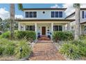 Inviting two-story home with a brick walkway and lush landscaping enhancing curb appeal at 510 33Rd N Ave, St Petersburg, FL 33704