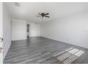 Bright living room with sleek gray floors and ample natural light at 725 2Nd Ne Ave, Largo, FL 33770