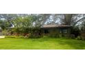 Lush landscaping featuring a variety of tropical plants surrounds this home, creating a private and inviting atmosphere at 8260 32Nd N Ave, St Petersburg, FL 33710