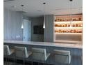 Contemporary kitchen with a white countertop, pendant lighting, and display shelving at 100 1St N Ave # 702, St Petersburg, FL 33701