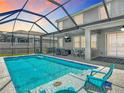 Inviting screened-in pool area with ample seating for entertaining at 1022 Montgomery Bell Rd, Wesley Chapel, FL 33543