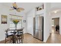Bright kitchen nook with stainless steel refrigerator and space for a breakfast table at 12925 Fieldmoor Ct, Riverview, FL 33579