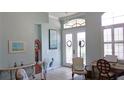 Inviting foyer with natural light, tiled floor, decorative wreaths, and an open floor plan at 16515 Nikki Ln, Odessa, FL 33556