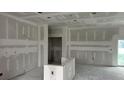 An interior view of the home's drywall and the doorway to another room at 17349 Pheasant Cir, Port Charlotte, FL 33948