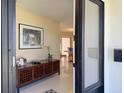 Bright foyer with a view of the living and dining area at 1775 62Nd S Ter, St Petersburg, FL 33712