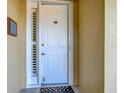Inviting front door with sidelight and decor, offering a warm welcome to the property at 3334 Purple Martin Dr # 212, Punta Gorda, FL 33950