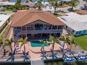 Stunning waterfront home with a private pool, spa, dock, and jet skis for ultimate relaxation at 514 Harbor N Dr, Indian Rocks Beach, FL 33785
