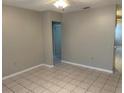 Neutral living room with tile floors, perfect for relaxing and entertaining at 6102 Massachusetts Ave, New Port Richey, FL 34653