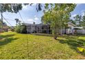 Large backyard featuring a screened-in patio, perfect for enjoying the outdoors at 6441 27Th N Ave, St Petersburg, FL 33710
