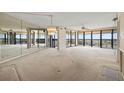 Bright living room with large windows offering panoramic views and lots of natural light at 9415 Blind Pass Rd # 1201, St Pete Beach, FL 33706
