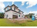 Modern home showing two stories, new construction, and a two-car garage with clean lines and bright windows at 944 31St Ne Ter, St Petersburg, FL 33704