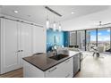 Open concept kitchen with island, stainless steel dishwasher, and city skyline view at 100 1St N Ave # 2207, St Petersburg, FL 33701