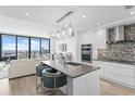 Bright, modern kitchen with a large island, stainless steel appliances, and city views at 100 1St N Ave # 2207, St Petersburg, FL 33701