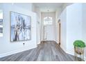 Grand foyer with hardwood floors, high ceilings, and elegant decor at 1603 Scotch Pine Dr, Brandon, FL 33511