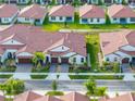 A captivating aerial view showcasing the home's location within a well-planned residential community at 17319 Holly Well Ave, Wimauma, FL 33598