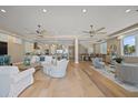 Expansive open-concept living space including a kitchen, dining area, and living room with hardwood floors at 2 Gulf Blvd, Indian Rocks Beach, FL 33785