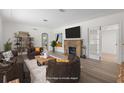 Staged living room featuring an inviting fireplace, neutral paint, and recessed lighting at 2449 16Th N St, St Petersburg, FL 33704
