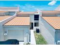 Charming condo featuring an attached garage with beautiful landscaping that enhances the curb appeal at 4360 Outrigger Ln, Tampa, FL 33615