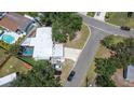 Aerial view of home showcasing backyard pool, patio, and proximity to the road at 489 Fox Run Trl, Apollo Beach, FL 33572
