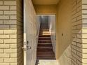 A welcoming entryway with beautiful wood stairs leading to the upper level at 507 E Curlew Pl, Tarpon Springs, FL 34689