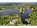 Beautiful aerial shot showcasing the tranquil lakefront location with lush surroundings and peaceful atmosphere at 5720 Half Moon Lake Rd, Tampa, FL 33625