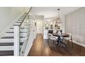 Inviting open-concept living space with staircase, and stylish hardwood floors at 6109 Bayside Key Dr, Tampa, FL 33615