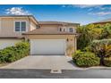 Charming home with a two-car garage featuring manicured landscaping including flowering bushes at 6627 Date Palm S Ave, St Petersburg, FL 33707
