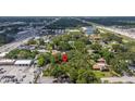 Overhead image of land in a neighborhood close to a four-lane road and local business at 717 E 137Th Ave, Tampa, FL 33613