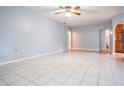 Expansive living room with tile floors, leading to other rooms in the house at 7347 Pulsar St, New Port Richey, FL 34652