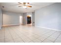 Spacious living room featuring tile flooring and neutral paint at 7347 Pulsar St, New Port Richey, FL 34652
