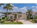 Inviting one-story home featuring lush landscaping, decorative plants, and a spacious driveway at 8223 Haven Harbour Way, Bradenton, FL 34212