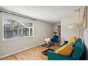 Bright living room featuring hardwood floors, stylish furniture, and natural light at 909 E 28Th Ave, Tampa, FL 33605