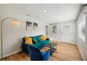 Cozy living room featuring sleek hardwood floors, bright decor and fresh paint at 909 E 28Th Ave, Tampa, FL 33605