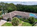 Aerial shot showcasing a pool and spacious backyard with access to the waterway at 9631 Oak Ne St, St Petersburg, FL 33702