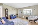 Cozy living room featuring a large window, ceramic flooring, and neutral paint at 1115 45Th N St, St Petersburg, FL 33713