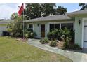 Charming single-story home with manicured landscaping and a welcoming entrance at 1665 Grove St, Clearwater, FL 33755