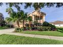 Beautiful two-story home with a well-kept lawn and mature landscaping at 3322 Cypress Landing Dr, Valrico, FL 33596